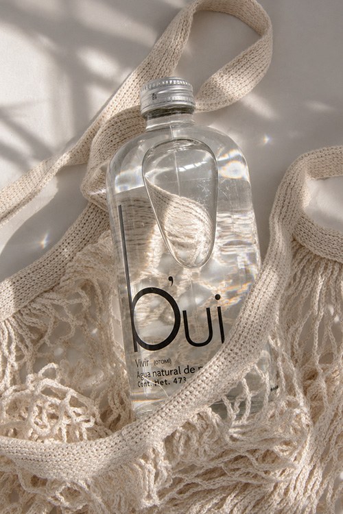 Botella b'ui en bolsa de red